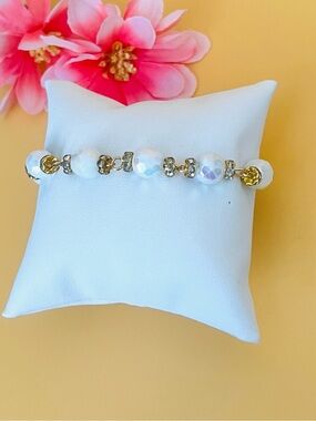 Gold plated bracelet, clear crystals & white beads plus a round toggle